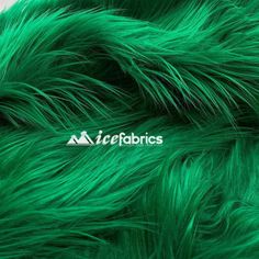 green furry fabric with white lettering on it