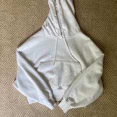 Super Cute And Soft Cropped Hoodie! Never Worn But Without Tags. Let Me Know If You Have Any Questions! It Comes From A Smoke Free Home! Cozy Kangaroo Pocket Tops For Streetwear, White Sporty Top With Kangaroo Pocket, Sporty White Top With Kangaroo Pocket, Cozy Streetwear Tops With Pockets, White Hoodie Tops With Pockets, White Athleisure Top With Kangaroo Pocket, Garage Tops, Cropped Hoodie, Let Me Know