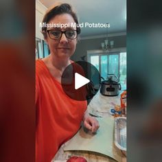 a woman in an orange shirt is cutting up food on a table with the words mississippi mud potatoes