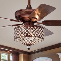 a chandelier hanging from the ceiling in a living room