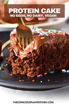 a chocolate cake with sprinkles on it and a fork in the middle