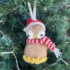 an owl ornament hanging from a christmas tree