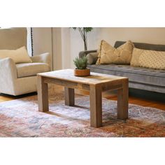 a living room filled with furniture and a rug