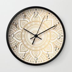 a wall clock with an intricate design on the front and back of it's face