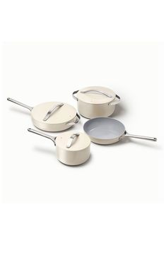 three white pots and pans with handles