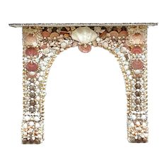 an arch with shells and seashells painted on the sides, isolated against a white background