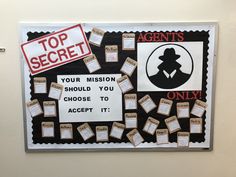 a bulletin board with several pieces of paper taped to it that says top secrets