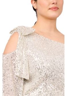 An off-the-shoulder neckline with cutouts defines this shimmery sequined bow-embellished blouse from CeCe. | CeCe Women's Plus Size Cold Shoulder Bow Sequin Blouse, Champagne, 2X Fall Party Blouse With Cold Shoulder, Fall Party Cold Shoulder Blouse, Chic Shimmer Blouse For Spring, Chic Spring Shimmer Blouse, Fitted Cold Shoulder Blouse For Party, Spring Evening Blouse With Shimmer, Elegant Cold Shoulder Top For Party, Off-shoulder Tops For Evening Party Season, Glamorous Off-shoulder Tops For Party Season