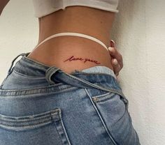 a woman's stomach with the word love written on it