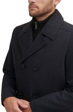 Add this classic wool peacoat to your wardrobe for an elevated style. Notched collar Long sleeves Button front Dual pockets 58% wool, 35% polyester, 4% acrylic, 3% other fibers Dry clean Imported Model stats: 6'1" height, 32" waist. Model is wearing size M. Casual Double-breasted Wool Coat With Double Button, Double-breasted Peacoat For Fall, Winter Solid Pea Coat With Double Button Closure, Solid Winter Pea Coat With Double Button Closure, Business Wool Coat With Buttons For Winter, Winter Pea Coat With Double-breasted Button Fastening, Classic Winter Outerwear With Button Closure, Modern Wool Outerwear For Winter, Wool Blazer For Winter