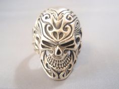 Silver Symbolic Skull Ring, Symbolic Silver Skull Ring, Silver Symbolic Skull Ring Hallmarked, Collectible Symbolic Skull Ring Stamped 925, Silver Skull-shaped Engraved Rings, Silver Skull Rings Hallmarked, Silver Skull Ring With Hallmark, Unique Silver Skull Ring Hallmarked, Skull Flowers Tattoo