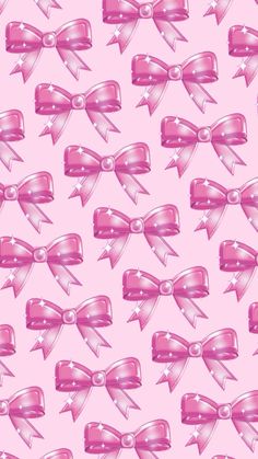 a pink background with many bows on it