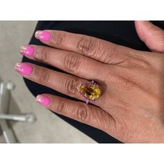 This gorgeous ring has a magnificent Pear Cut Citrine Quartz weighing 5.28 Carats and is surrounded by 25 Pink and Yellow Sapphires that weigh 0.60 carats and 20 Round Cut Diamonds that weigh 0.37 carats. (Clarity: SI, Color: F) The total carat weight of the ring is 6.25 carats. Each stone is handpicked and carefully curated to create a unique piece by our in-house designer and jeweler! The Citrine measures approximately at 11 mm x 16 mm. It is set in 14K White Gold and weighs approximately 3.8 grams. The ring is a size 7  Exact dimensions for this item are unknown. Please reach out in the seller Q&A for any questions on measurements. Luxury Multi-stone Yellow Gemstones, Luxury Yellow Multi-stone Gemstones, Yellow Multi-stone Round Gemstones, Yellow Multi-stone Sapphire Ring, Luxury Yellow Sapphire Multi-stone Ring, Luxury Yellow Gemstones With Accent Stones, Elegant Yellow Sapphire Multi-stone Jewelry, Elegant Multi-stone Yellow Sapphire Jewelry, Formal Yellow Multi-stone Diamond Ring