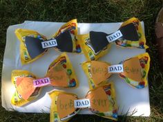 a bunch of bow ties that say dad and have been made to look like candy