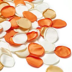 an assortment of orange and white heart shaped confetti