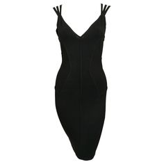 Jet-black knit dress with corseted waist and unique triple straps designed by Azzedine Alaia exactly as seen on the spring 1990 runway. Size XS. Approximate measurements (unstretched): bust 30", waist 24, hips 32" and length 36.5". Fabric content: 85% cotton and 15% elastane. Made in Italy. Very good condition. 1990 Runway, Black Runway Dress, Vampire Core, Black Runway, Azzedine Alaïa, Azzedine Alaia, Black Knit Dress, Runway Dresses, Mini Dress Black