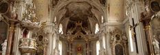 the interior of an old church with gold and white decorations