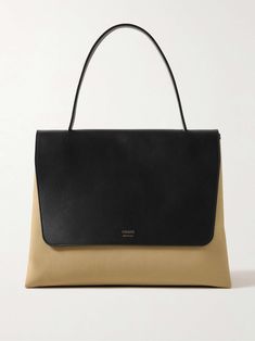 Shop KHAITE Lia large leather and canvas tote, Explore the latest KHAITE women's collection today on NET A PORTER Black Designer Bags, Cosmetics Pouch, Designer Cosmetic Bag, Woven Leather Tote, Canvas Leather Tote, Large Leather Tote Bag, Leather And Canvas, Large Leather Tote, Cosmetic Pouch