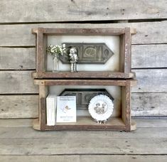 two wooden shelves with decorative items on them