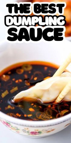 the best dumpling sauce is in a white bowl with chopsticks sticking out of it