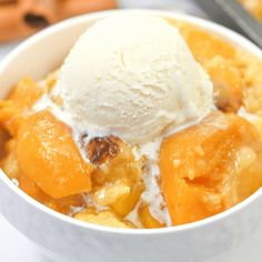 a white bowl filled with fruit and ice cream