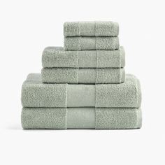 six folded towels stacked on top of each other