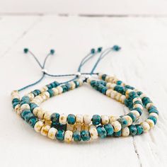 beach side // turquoise blue and white beaded cord bracelet – Peacock & Lime Mala Beads Bracelet, Wave Bracelet, Beach Side, Cord Ends, Cord Bracelet, Beach Ready, Silver Bead, Cord Bracelets, Summer Jewelry