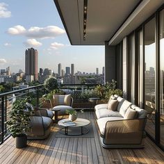 a balcony with couches, tables and plants on the deck overlooking cityscape