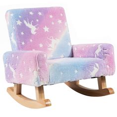 a rocking chair with unicorns and stars on it