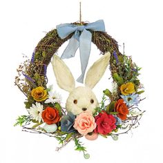 a wreath with an easter bunny and flowers