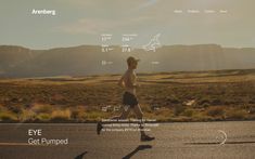 a man running on the road with mountains in the background