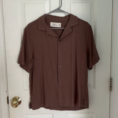 Brown Short Sleeve Button Up Shirt Great Condition Never Worn Brown Button-up Tops With Placket, Brown Collared Top With Placket, Brown Collared Top With Button Closure, Brown Spread Collar Tops For Spring, Brown Relaxed Fit Top With Placket, Spring Brown Spread Collar Top, Casual Brown Johnny Collar Top, Casual Brown Top With Johnny Collar, Brown Spread Collar Tops With Buttons