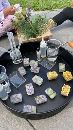 a tray with some ice cubes sitting on top of it next to other items