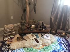 an assortment of items are arranged on a rug in the middle of a living room