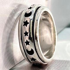 This Moon and Stars Spinner Ring in Silver, Moon Ring, Star Ring, Celestial Ring, Celestial Jewelry, Moon and Star Ring, Celestial Spinner Ring design is inspired by moon and stars. A Perfect Gift for people who want to find Peace of Mind or more calmness. The ring can be more valuable if you associate it with a relaxing event, thought, or action. Tis the season to spark joy with Moon and Stars spinning through your finger.  This ring is a great little reminder to relieve stress and anxiety and Silver Moon Ring, Celestial Ring, Moon And Star Ring, Moon Ring, Meditation Rings, Silver Spinner Rings, Celestial Jewelry, Moon And Star, Spinner Ring