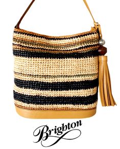 What's not to love... You will be effortlessly elegant when you carry this "Colora" raffia handbag from the Ferrara collection.  Each straw bag is uniquely woven by hand using exquisite raffia fibers...you are wearing a work of art!   The sleek striped  design is enhanced with gorgeous honey leather.  An 8 1/2" tassel adds an extra touch of classy attitude to this handbag. Outside: New with outlet tag - $320 Style:  H73244  10 1/2" high, 13" wide (at the top) - 10 3/4" (at the bottom) and 4 3/4" deep Magnetic closure  Raffia straw - multicolored striped  8 1/2" honey leather tassel topped with a large faceted wooden bead and silver toned ball    Honey leather strap - 9" strap drop Brighton signature leather and silver tone heart fob dangles on the outside   Inside: One main compartment  Tw Elegant Woven Leather Shoulder Bag For Vacation, Elegant Woven Hobo Bag For Vacation, Elegant Woven Hobo Bag For Beach, Elegant Woven Natural Hobo Bag, Elegant Handwoven Bucket Bag For Vacation, Luxury Handwoven Crochet Bag For Beach, Luxury Woven Rectangular Bucket Bag, Luxury Rectangular Woven Bucket Bag, Luxury Natural Rectangular Hobo Bag