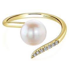 Sophisticated with a touch of edge, this 14K yellow gold ring wraps around the finger with a stylish open silhouette. Showcasing shimmering 0.04ct diamonds and a lustrous pearl, this graceful style is a luxe finishing touch to any ensemble. Wedding Nails Pearl, Pearl Engagement Rings, Nails Pearl, Ring Wraps, Graceful Style, Natural Pearl Ring, Pearl Engagement Ring, Gold Rings Stackable, Wrap Ring