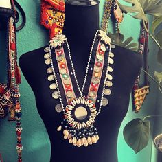 These necklaces are made from vintage shells, medallions & trim from Pakistan.  ❤️ OkLet me seemy buyer in Pakistan asked me if I would be interested in a large amount of beaded Kuchi itemshe then sent me some photos & I was in love! So long story short I received a huge amount of necklaces, bibs, belts & bags as well as the usual beaded medallions. I got a great price because of the amount I purchased which is why I can sell them on here at a very reasonable price. So....all of these items are "vintage" (vintage is classed as 20 years or older....I recently experienced a disgruntled buyer who stated "vintage really means vintage" "why yes sweetie, you're 100% correct, it really does"), they are not new, they are not even close to new. If you are looking for something "brand new" these are One-of-a-kind Medallion Necklace For Festivals, Bohemian Medallion Necklace From Vintage Collection, Bohemian Medallion Necklace With Vintage Charm, Handmade Vintage Coin Necklace For Festivals, Beaded Medallion Necklace For Festivals, Handmade Medallion Coin Necklace For Festivals, Unique Medallion Necklaces For Festivals, Bohemian Silver Shell Necklace For Festival, Vintage Beaded Necklaces For Festivals