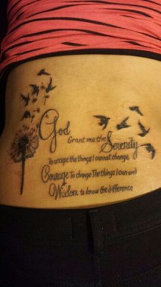 a woman's lower back tattoo with birds and words on the bottom part of her stomach