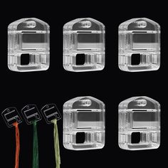 four pieces of clear plastic with wires attached to them