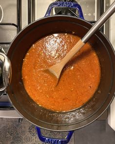 a wooden spoon in a saucepan on the stove