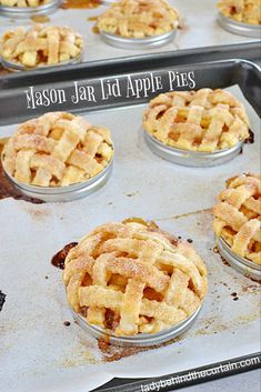 freshly baked apple pies on a baking sheet ready to be baked in the oven