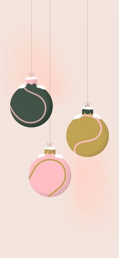 three ornaments hanging from strings in different colors