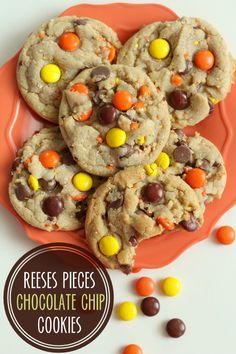 reese's pieces chocolate chip cookies on an orange plate with candy candies around it