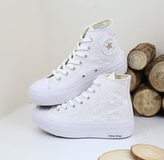 Explore our custom wedding Converse Platform shoes, featuring beautiful white flower embroidery for a unique and stylish touch on your special day!  Detailed Product Information - Shoe Type: Converse (high tops or low tops) 👟 - Customization: Hand-embroidered flowers, bees, pets, songs, wedding bouquets, birthdays, wedding dates, and more. We can bring all your ideas to life! ✨🐝 - Material: Durable, unfading embroidery on new shoes purchased directly from the store 🏬 - Note About Size: Converse shoes typically run large. Consider ordering half a size smaller if you have narrow feet, or choose your regular size if you have wider feet. 📏f you already own Converse shoes, choose your usual size. * **Prices and Orders - Price: Includes Converse shoes and embroidery as shown 💰 - Additional Wedding Reception Shoes, Wedding Converse Bride, Sneakers For Bride, Platform Shoes White, Bridal Converse, Wedding Platform, Reception Shoes, Converse Wedding Shoes, Embroidered Sneakers