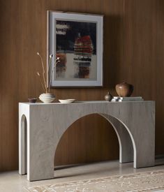 a modern console table with two bowls on it