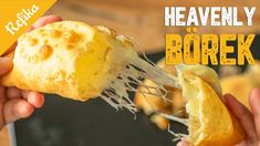 a person holding up a piece of bread with cheese on it and the words, heavenly borek