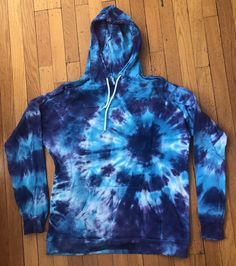 Tie-dye adult hoodie sweatshirt, pullover, kangaroo pocket, drawstring on hood. Hand-dyed. 100% cotton. Machine washable. Sizes run small. Sizes XL - 3X available; please inquire if the color you want is available in the size you want. If you want a color or size I don't have here, let me know and I'll custom-make one for you! Also, hoodies with a zipper available on a custom-order basis for an additional cost. Blue Streetwear Hoodie With Drawstring, Blue Hoodie With Drawstring For Winter, Blue Drawstring Hoodie For Winter, Blue Drawstring Hoodie Sweatshirt, Acid Wash Relaxed Fit Sweatshirt With Kangaroo Pocket, Relaxed Fit Acid Wash Sweatshirt With Kangaroo Pocket, Blue Sweats With Drawstring Hood For Fall, Blue Fall Sweats With Drawstring Hood, Acid Wash Hoodie With Kangaroo Pocket And Long Sleeves