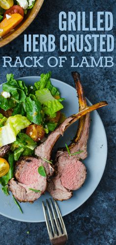 grilled herb crusted rack of lamb on a plate with a salad and fork