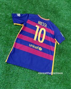 a soccer jersey laying on the grass with it's number ten printed on it